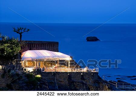 Restaurant lit up at night, Spain View Large Photo Image Stock Image - Restaurant lit up at night, Spain . Fotosearch