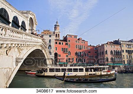 Stock Photo - Rialto Bridge and boats on the Canale Grande, Venice, Italy . Fotosearch