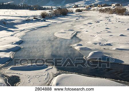 Stock Photo - River flowing through polar landscape, Colorado, USA . Fotosearch