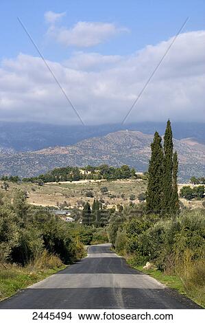 Road passing through landscape, Crete, Greece View Large Photo Image Picture - Road passing through landscape, Crete, Greece . Fotosearch