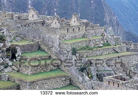 Stock Image - Ruins of buildings at archaeological site, Inca Ruins, Machu Picchu, Cusco Region, Peru . Fotosearch