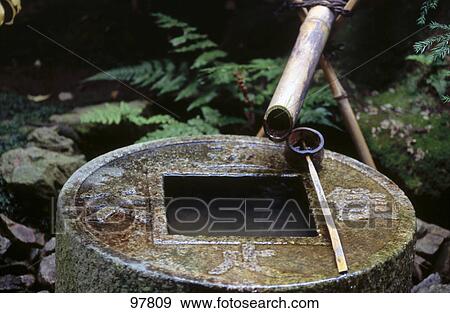 Stock Photo - Sacred water tank in japanese garden, Kyoto, Japan . Fotosearch