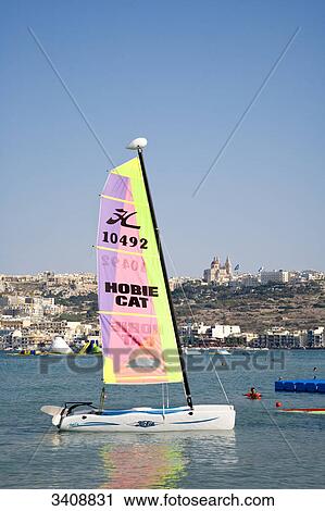 Sailing boat at Mellieha Bay, town in the background, Malta View Large Photo Image Stock Image - Sailing boat at Mellieha Bay, town in the background, Malta . Fotosearch