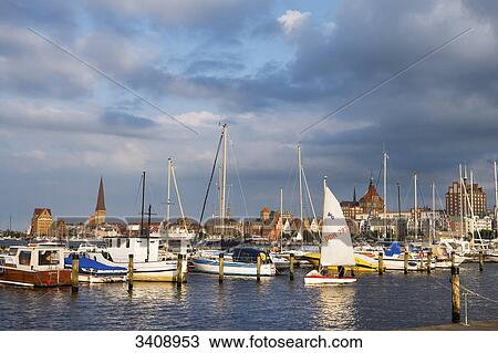 Stock Image - Sailing boats on the Wanow river, Rostock, Germany . Fotosearch