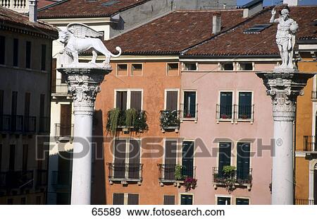 Sculptures on columns in town, Vicenza, Italy View Large Photo Image Stock Photo - Sculptures on columns in town, Vicenza, Italy . Fotosearch