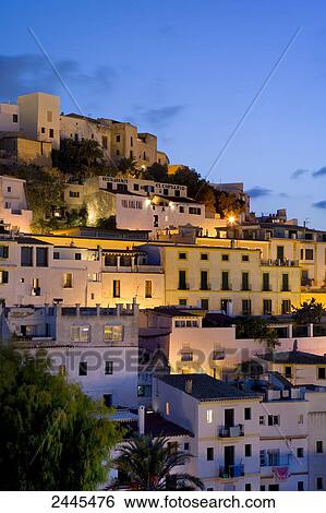 Sea with town in background, Dalt Vila, Ibiza, Balearic Islands, Spain View Large Photo Image Stock Photograph - Sea with town in background, Dalt Vila, Ibiza, Balearic Islands, Spain . Fotosearch