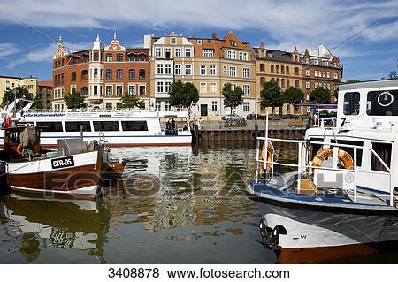 Stock Photo - Ships and boats at the harbour of Stralsund, Germany . Fotosearch