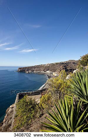 Stock Image - Shore line in Playa Santiago, La Gomera, Spain, elevated view . Fotosearch