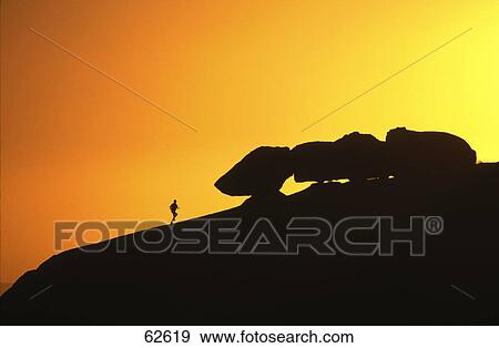 Silhouette of man on mountain View Large Photo Image Stock Photo - Silhouette of man on mountain . Fotosearch