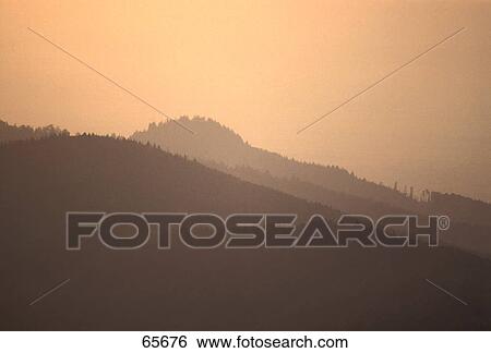 Stock Photograph - Silhouette of mountains at dusk, Germany . Fotosearch