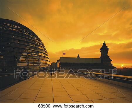 Stock Image - Silhouette of people in front of parliament building, Reichstag, Berlin, Germany . Fotosearch