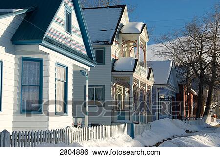 Stock Photograph - Snow in front of houses, Colorado, USA . Fotosearch
