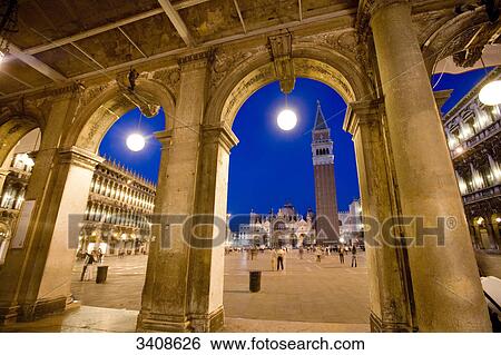 Stock Photograph - St. Marcus Square seen through arches, Venice, Italy, low angle view . Fotosearch