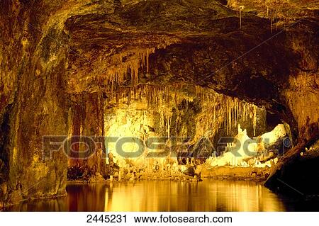 Stalagtites illuminated above pool of water in cave, Saalfeld, Thuringia, Germany View Large Photo Image Stock Image - Stalagtites illuminated above pool of water in cave, Saalfeld, Thuringia, Germany . Fotosearch