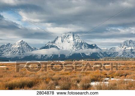 Storm clouds over snowcapped mountains, Grand Teton, Grand Teton National Park, Wyoming, USA View Large Photo Image Stock Photo - Storm clouds over snowcapped mountains, Grand Teton, Grand Teton National Park, Wyoming, USA . Fotosearch