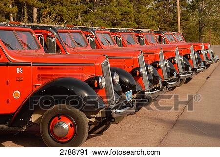 Stock Image - Taxi parked in row at taxi stand, Glacier National Park, Montana, USA . Fotosearch