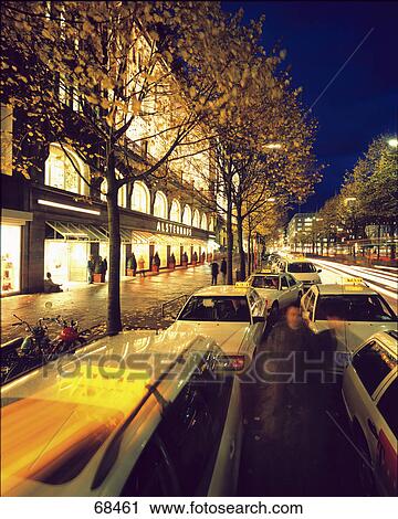 Stock Image - Taxis in row on road, Hamburg, Germany . Fotosearch