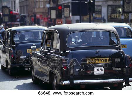 Stock Photo - Taxis on road, London, England . Fotosearch