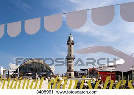 Stock Image - Teepott and lighthouse in Warnemuende, Rostock, Germany . Fotosearch