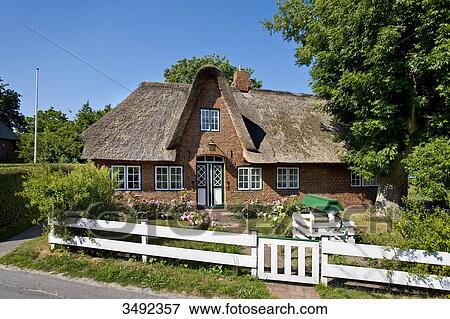 Thatched-roof house in Keitum, Sylt, Germany View Large Photo Image Stock Photo - Thatched-roof house in Keitum, Sylt, Germany . Fotosearch