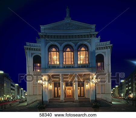 Stock Image - Theater building lit up at night, State Theater, Gaertnerplatz, Munich, Bavaria, Germany . Fotosearch