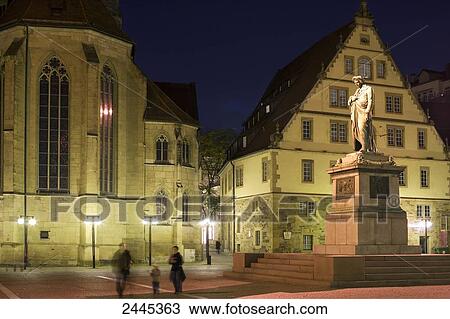 Three people standing in front of memorial, Schillerplatz, Stuttgart, Baden-Wuerttemberg, Germany View Large Photo Image Stock Image - Three people standing in front of memorial, Schillerplatz, Stuttgart, Baden-Wuerttemberg, Germany . Fotosearch