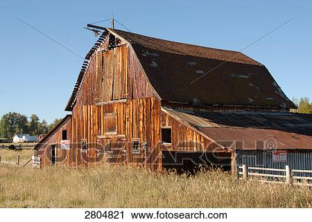 Stock Image - Timber house in field, Philipsburg, Montana, USA . Fotosearch