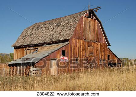 Stock Image - Timber house in field, Philipsburg, Montana, USA . Fotosearch