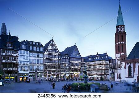 Tourists at town square during dusk, Frankfurt, Hesse, Germany View Large Photo Image Stock Photograph - Tourists at town square during dusk, Frankfurt, Hesse, Germany . Fotosearch
