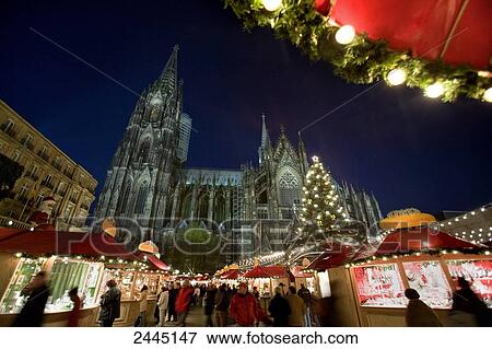 Stock Photo - Tourists in front of cathedral at market . Fotosearch