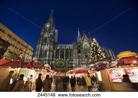 Tourists in front of cathedral at market View Large Photo Image Stock Photo - Tourists in front of cathedral at market . Fotosearch