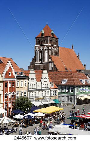 Tourists in market near church, St. Mary's Church, Greifswald, Mecklenburg-West Pomerania, Germany View Large Photo Image Stock Photo - Tourists in market near church, St. Mary's Church, Greifswald, Mecklenburg-West Pomerania, Germany . Fotosearch