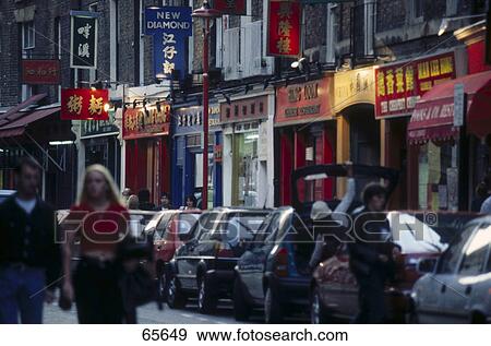Tourists in street market, Chinatown, London, England View Large Photo Image Stock Photo - Tourists in street market, Chinatown, London, England . Fotosearch
