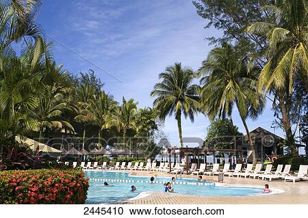 Tourists in swimming pool in resort, Damai Beach Resort, Kuching, Sarawak, Borneo, Indonesia View Large Photo Image Stock Image - Tourists in swimming pool in resort, Damai Beach Resort, Kuching, Sarawak, Borneo, Indonesia . Fotosearch