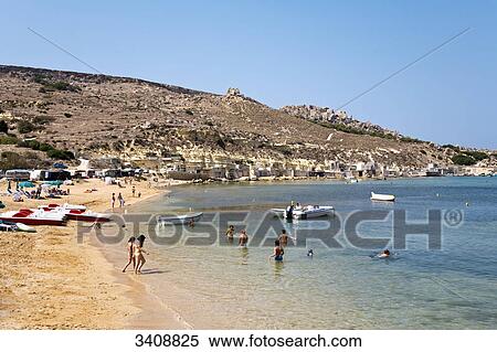 Tourists on a beach, Gnejna Bay, Malta, elevated view View Large Photo Image Stock Photography - Tourists on a beach, Gnejna Bay, Malta, elevated view . Fotosearch