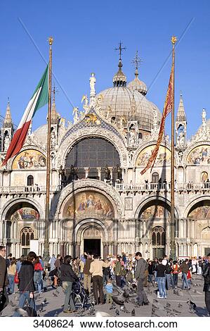Tourists on St Marks Square in front of the Basilica of San Marco, Venice, Italy View Large Photo Image Picture - Tourists on St Marks Square in front of the Basilica of San Marco, Venice, Italy . Fotosearch