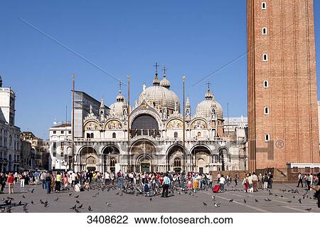 Stock Image - Tourists on St Marks Square in front of the Basilica of San Marco, Venice, Italy . Fotosearch