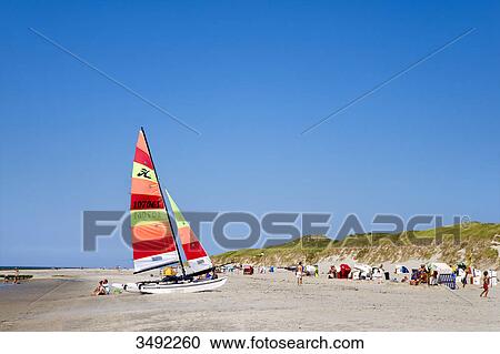Tourists on the beach in Norddorf, Amrum, Schleswig-Holstein, Germany View Large Photo Image Stock Image - Tourists on the beach in Norddorf, Amrum, Schleswig-Holstein, Germany . Fotosearch
