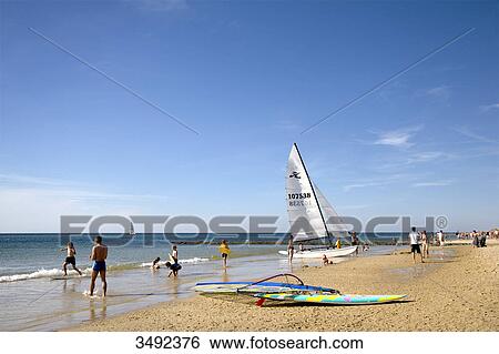 Stock Photograph - Tourists on the beach in Westerland, Sylt, Schleswig-Holstein, Germany . Fotosearch