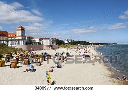 Tourists on the beach of Binz, spa hotel in the background, Ruegen, Germany, elevated view View Large Photo Image Stock Photo - Tourists on the beach of Binz, spa hotel in the background, Ruegen, Germany, elevated view . Fotosearch