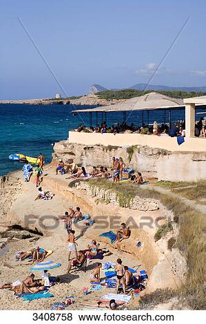 Tourists on the beach of Cala Comte, Ibiza, Spain, elevated view View Large Photo Image Stock Photo - Tourists on the beach of Cala Comte, Ibiza, Spain, elevated view . Fotosearch