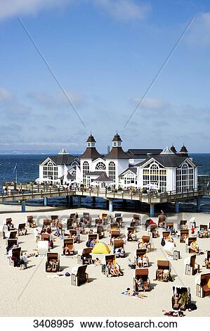 Tourists on the beach, Sellin pier in the background, Ruegen, Germany, elevated view View Large Photo Image Stock Photography - Tourists on the beach, Sellin pier in the background, Ruegen, Germany, elevated view . Fotosearch