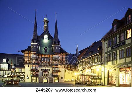 Stock Photo - Town Hall illuminated at dusk, Saxony-Anhalt, Germany . Fotosearch