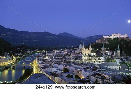 Stock Photo - Town with castle in background, Salzach River, Burg Hohenwerfen Castle, Salzburg, Austria . Fotosearch