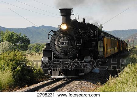 Stock Image - Train moving on track passing through landscape, Silverton, Durango, La Plata County, Colorado, USA . Fotosearch