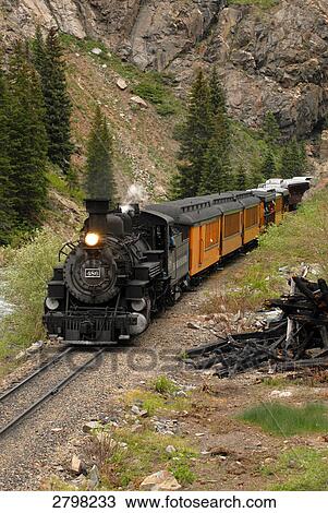Stock Image - Train moving on track passing through landscape, Silverton, Durango, La Plata County, Colorado, USA . Fotosearch