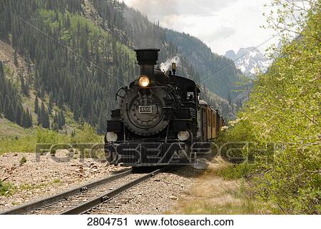 Train moving on track passing through landscape, Colorado, USA View Large Photo Image Stock Image - Train moving on track passing through landscape, Colorado, USA . Fotosearch