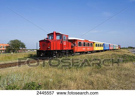 Train on tracks, Langeoog, Lower Saxony, Germany View Large Photo Image Stock Photo - Train on tracks, Langeoog, Lower Saxony, Germany . Fotosearch
