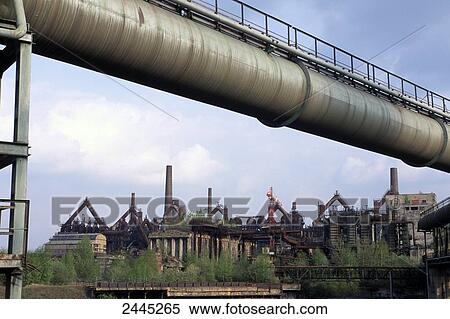 Trees in front of industrial building, Voelklingen Ironworks, Saarland, Germany View Large Photo Image Stock Photography - Trees in front of industrial building, Voelklingen Ironworks, Saarland, Germany . Fotosearch