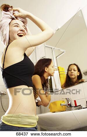 Two teenage girls having fun in bathroom View Large Photo Image Stock Photo - Two teenage girls having fun in bathroom . Fotosearch